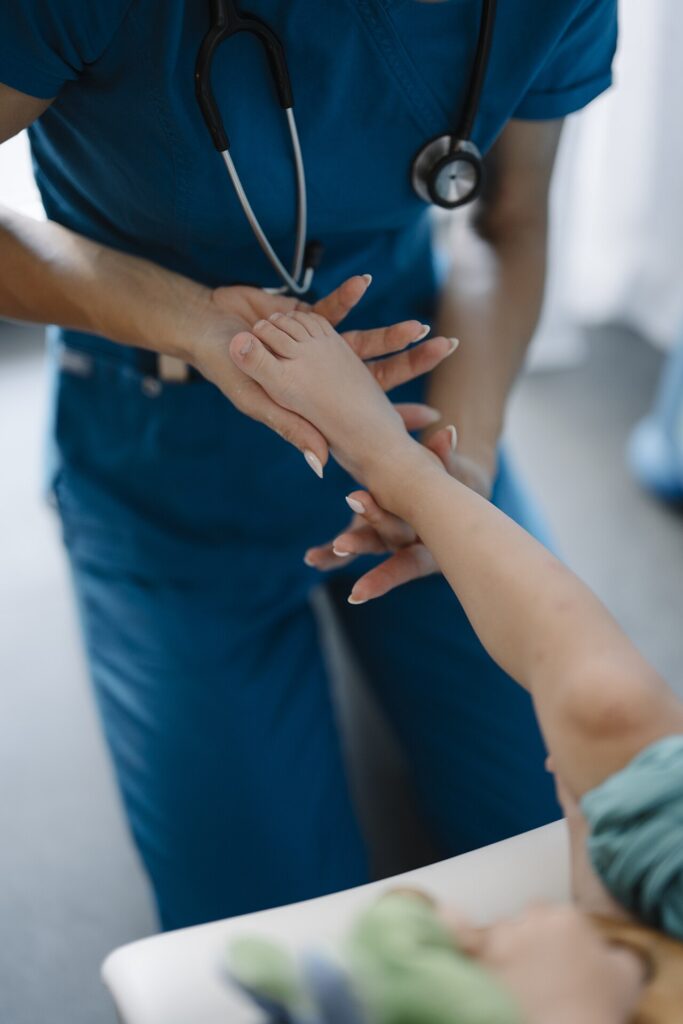 Healthcare worker examines patient during a routine check in a medical office setting.jpg