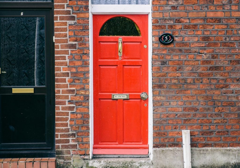 closed red 6-panel door
